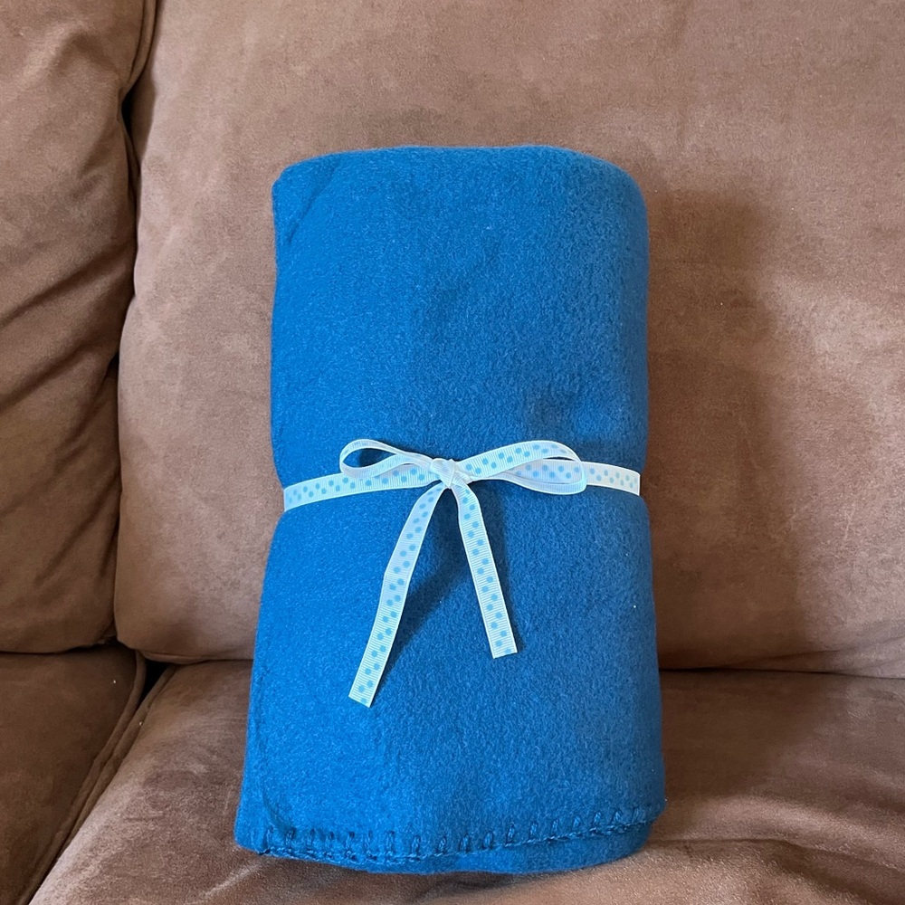Blue Fleece Throw with blanket stitch edging 50"X60". 100% polyester. NEW